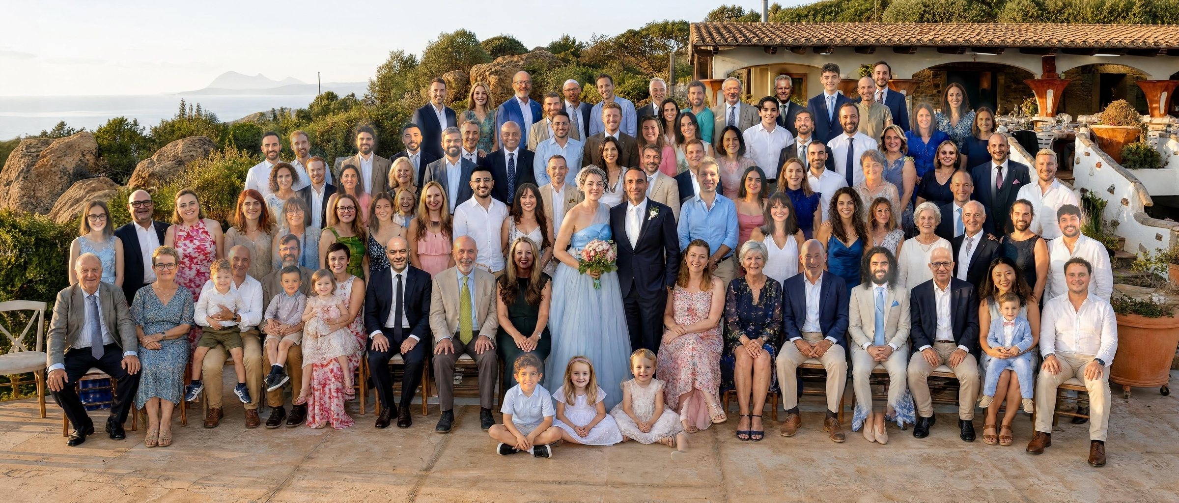 An AI-made group photo of all the wedding guests on the terrace at Sa Guardia at sunset